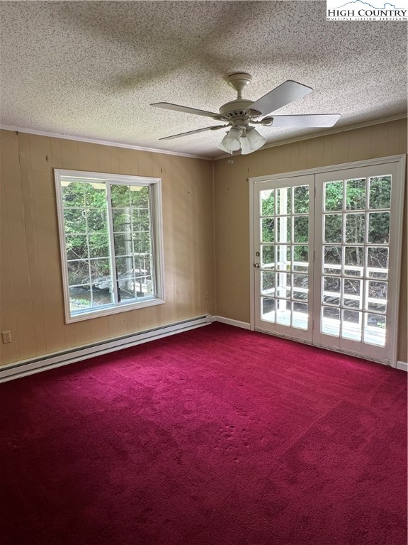 232 Cole Hollow Road Newland, NC 28657 - Photo 19 of 31 an empty room with chandelier fan and windows