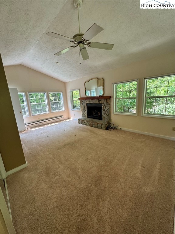 232 Cole Hollow Road Newland, NC 28657 - Photo 22 of 31 a view of an empty room with a fireplace and a window