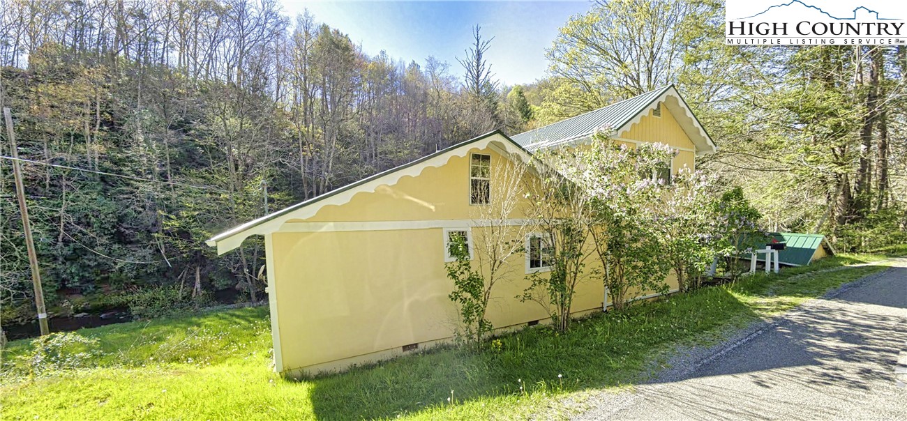 232 Cole Hollow Road Newland, NC 28657 - Photo 30 of 31 a view of a small house with a tree