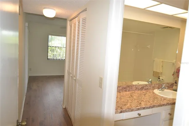 a view of a bathroom with a shower and a sink