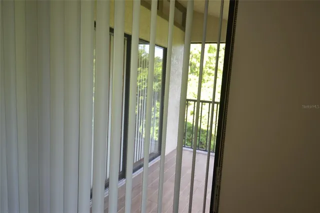 a view of a room with large windows