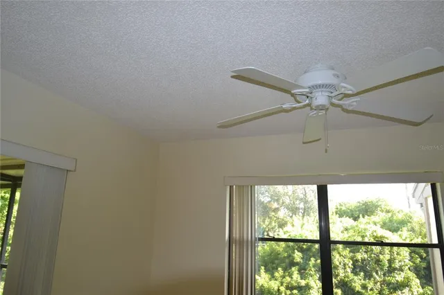 a view of a hall way with furniture