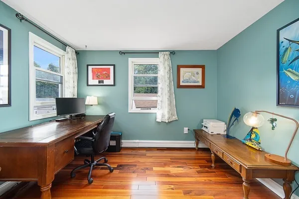 a workspace with furniture and window