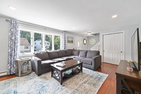 a living room with furniture and a table