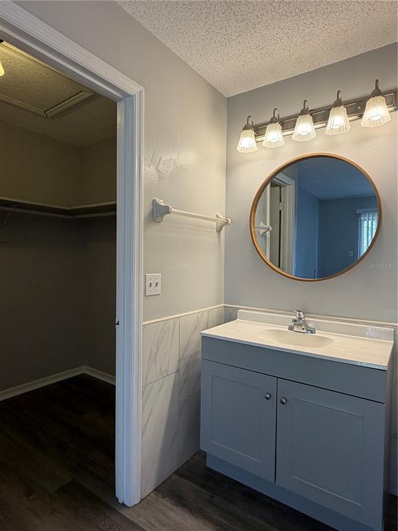 1215 Ravida Circle Orlando, FL 32825 - Photo 18 of 22 a bathroom with a sink and a mirror