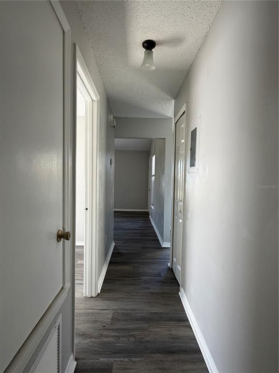 1215 Ravida Circle Orlando, FL 32825 - Photo 21 of 22 a view of a hallway with the wooden floor