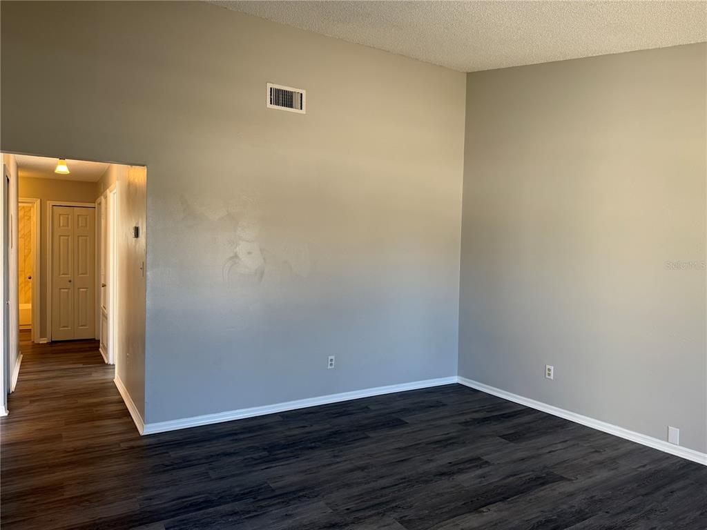 1215 Ravida Circle Orlando, FL 32825 - Photo 6 of 22 a view of a small space with wooden floor