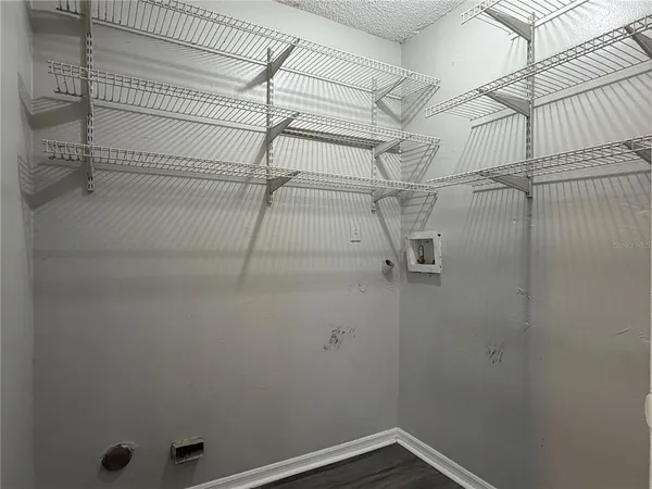 a view of a room with racks on the wall