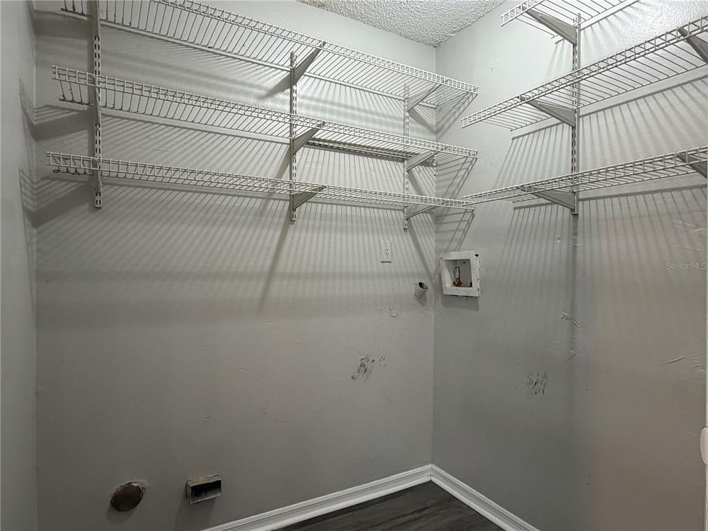 1215 Ravida Circle Orlando, FL 32825 - Photo 9 of 22 a view of a room with racks on the wall