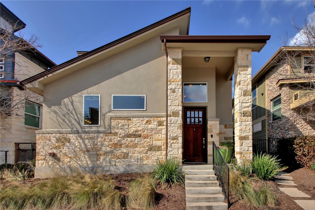 7502 Pantherpaw Street Austin, TX 78757 - Photo 1 of 1 a front view of a house with a garden
