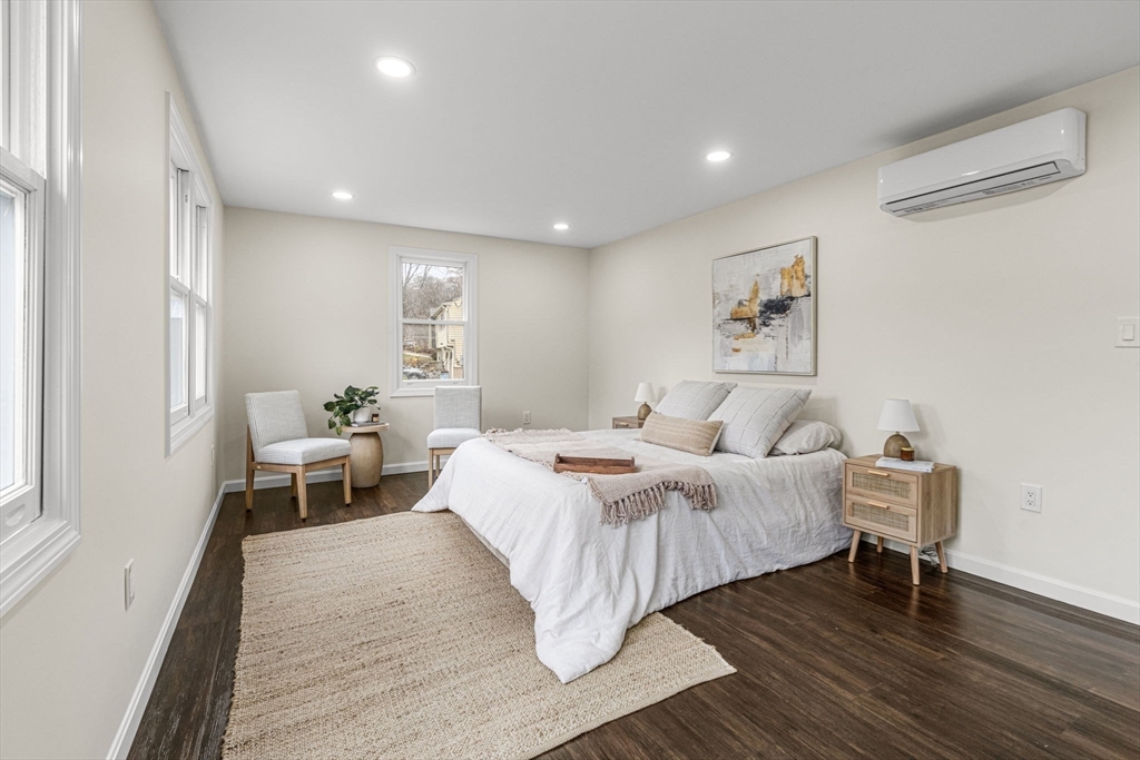 7 Old North Road Hudson, MA 01749 - Photo 11 of 39 a bed room with a bed and a chair