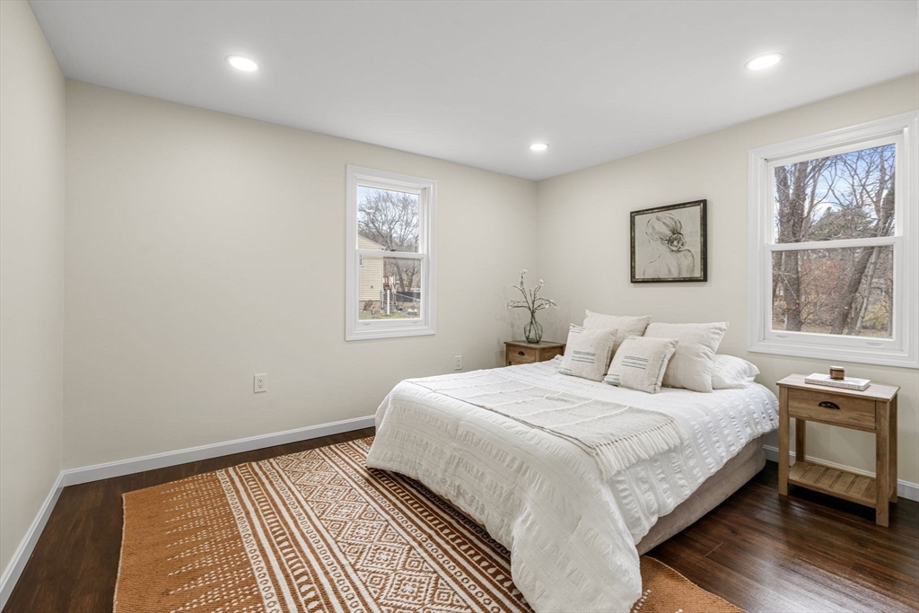 7 Old North Road Hudson, MA 01749 - Photo 15 of 39 a bedroom with a large bed and a window