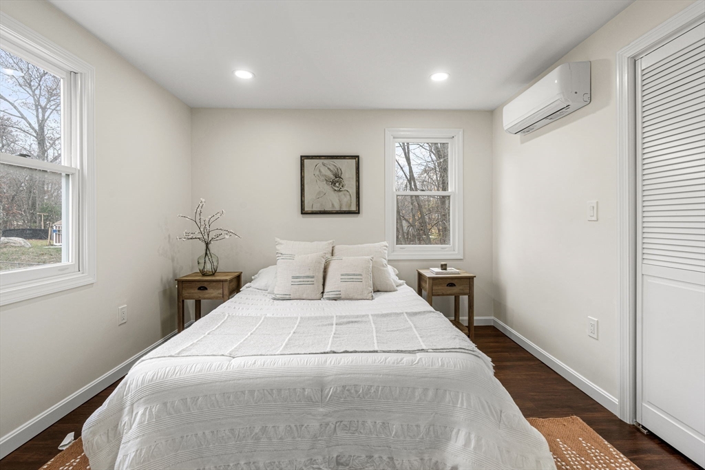 7 Old North Road Hudson, MA 01749 - Photo 16 of 39 a bedroom with a large bed and a window