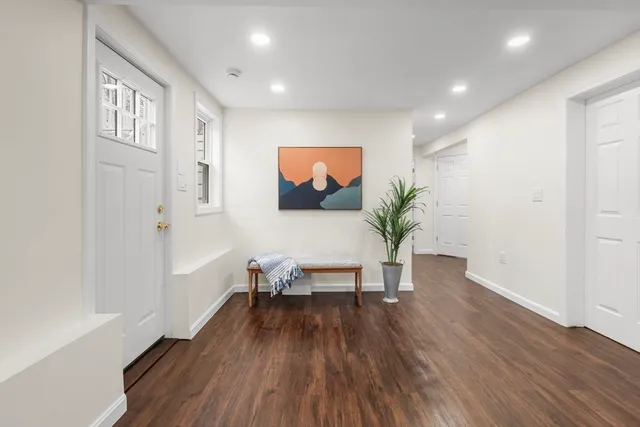 a view of a livingroom with furniture and wooden floor