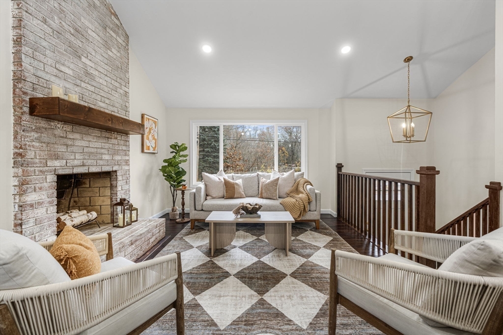7 Old North Road Hudson, MA 01749 - Photo 2 of 39 a living room with furniture and a fireplace