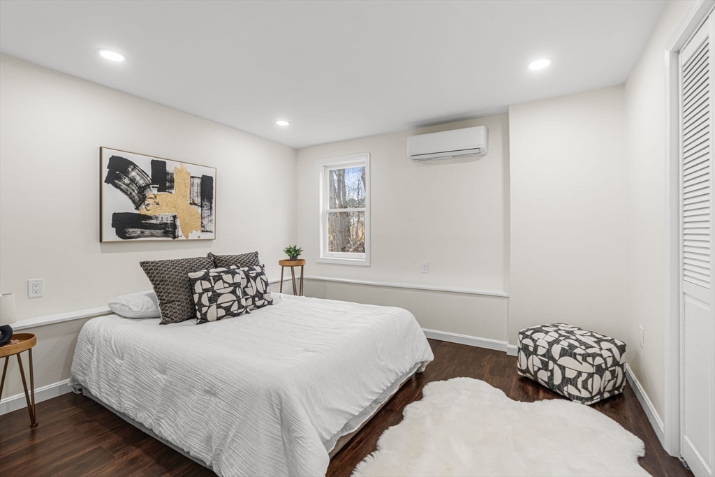 7 Old North Road Hudson, MA 01749 - Photo 27 of 39 a bedroom with a bed and wooden floor