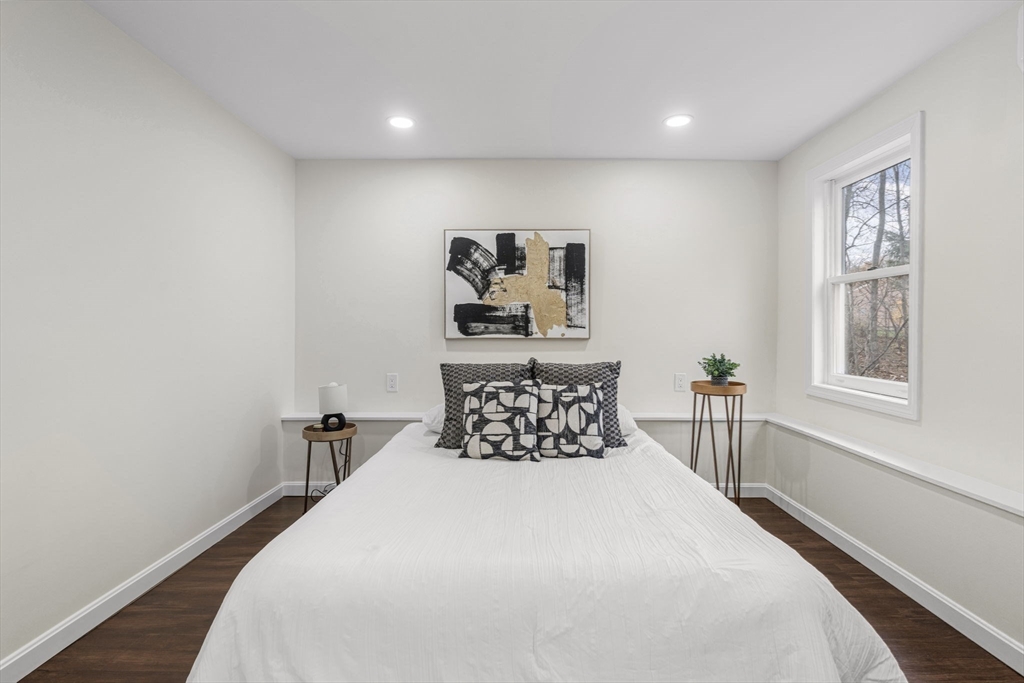 7 Old North Road Hudson, MA 01749 - Photo 28 of 39 a bedroom with a bed and wooden floor
