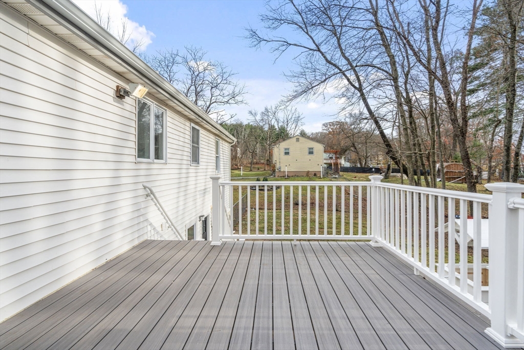 7 Old North Road Hudson, MA 01749 - Photo 31 of 39 a view of a wooden deck with trees