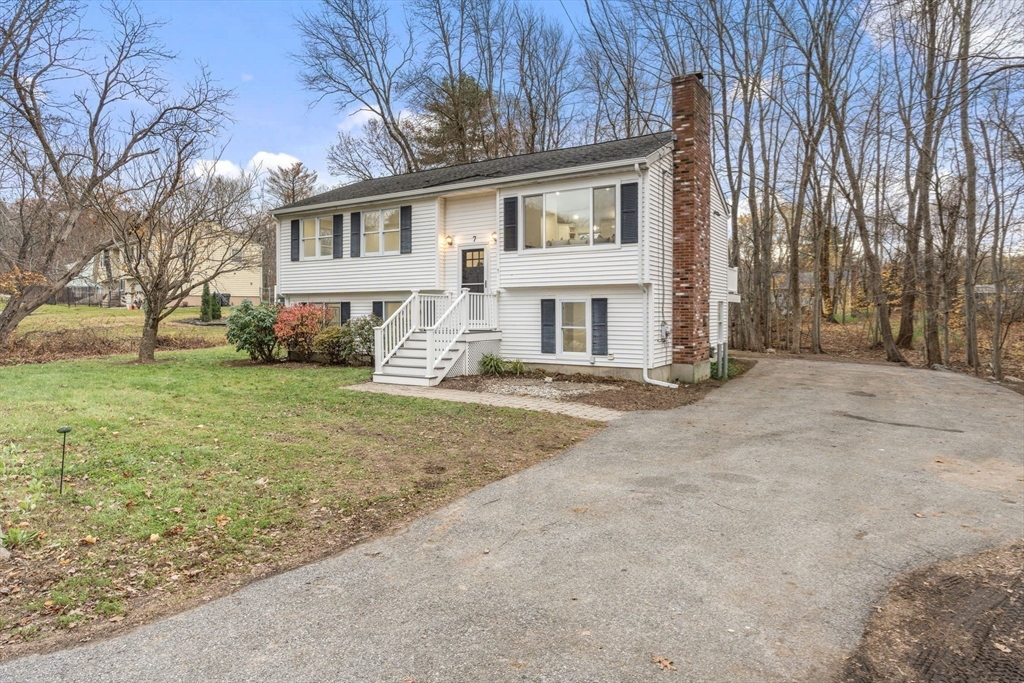 7 Old North Road Hudson, MA 01749 - Photo 34 of 39 a front view of a house with a yard