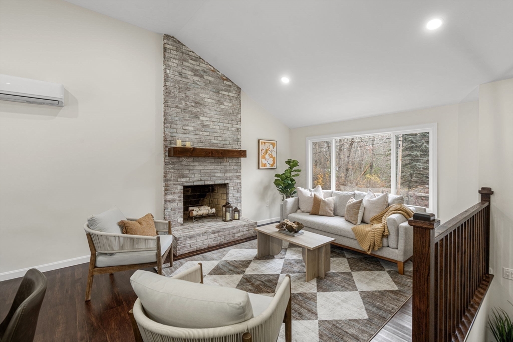 7 Old North Road Hudson, MA 01749 - Photo 6 of 39 a living room with furniture a fireplace and a large window