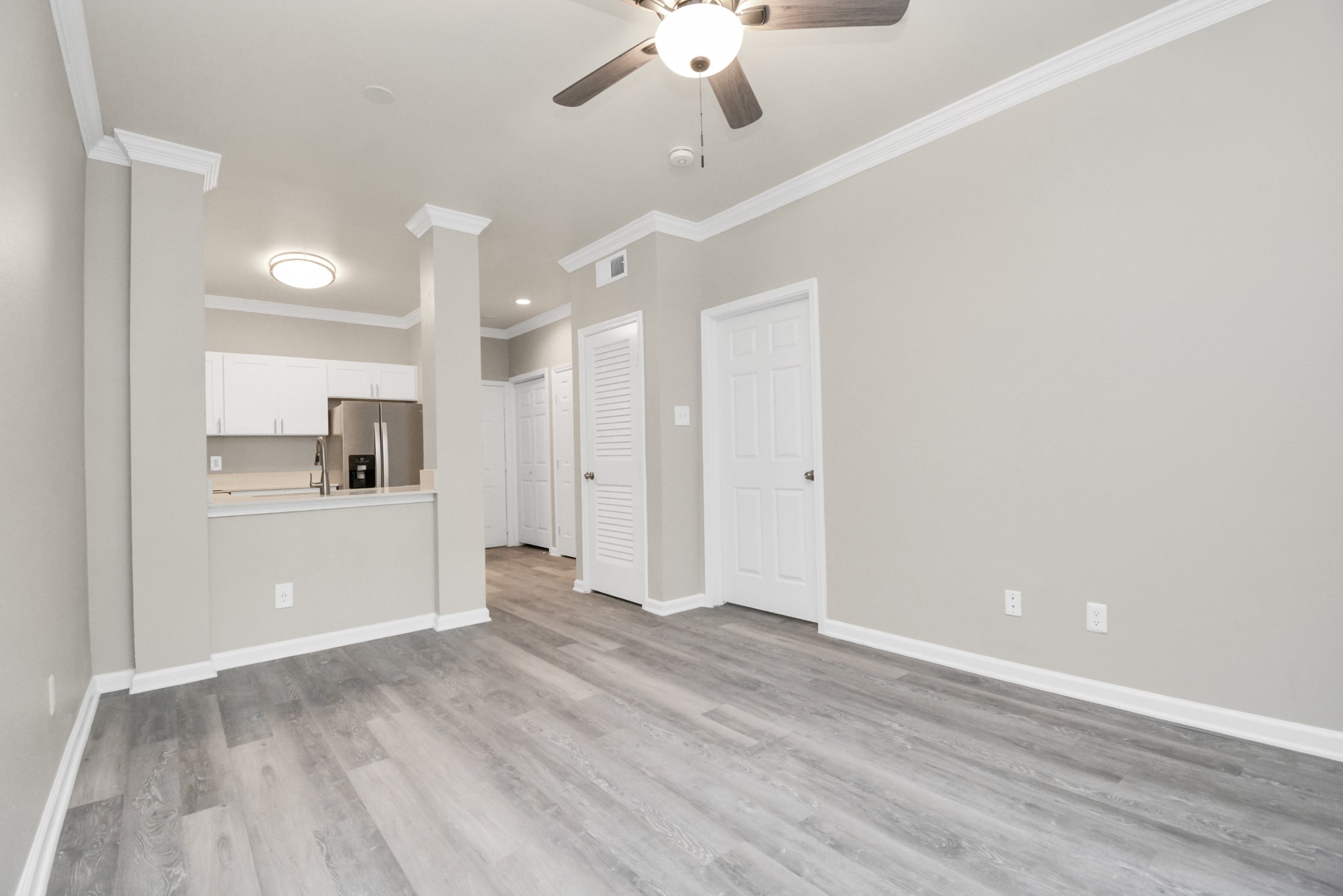 2222 Maroneal Street, Unit 931 Houston, TX 77030 - Photo 9 of 15 a view of a kitchen with an empty space and a kitchen view
