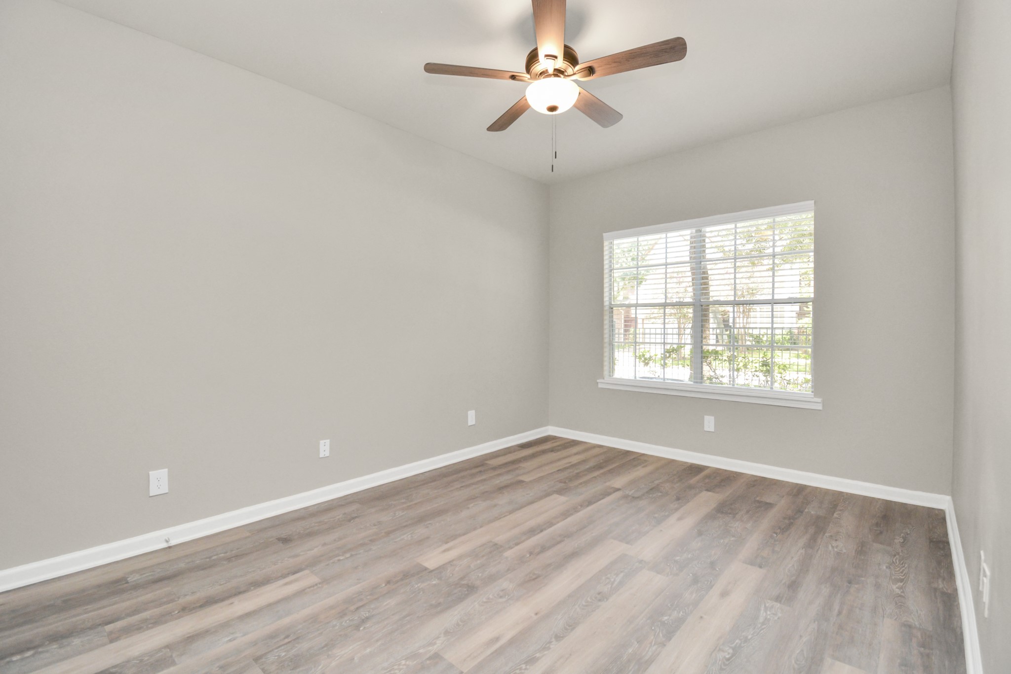 2222 Maroneal Street, Unit 931 Houston, TX 77030 - Photo 10 of 15 wooden floor in an empty room with a window