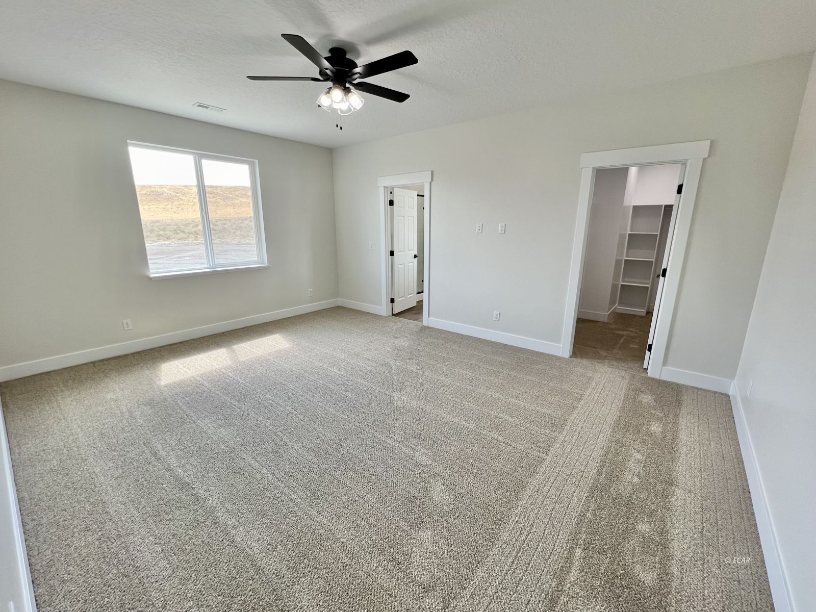 610 Ridgeway Drive Spring Creek, NV 89815 - Photo 21 of 33 an empty room with windows and fan