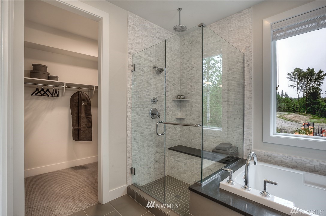 22009 33rd Drive Southeast, Unit 40 Bothell, WA 98021 - Photo 25 of 25 a bathroom with a shower and mirror