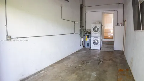 a view of a storage & utility room with racks on the wall