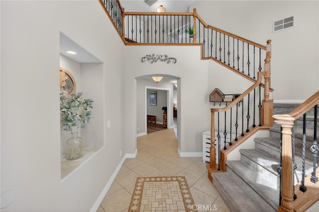28322 Corte Ocaso Temecula, CA 92592 - Photo 11 of 75 a view of hallway with wooden floor and stairs