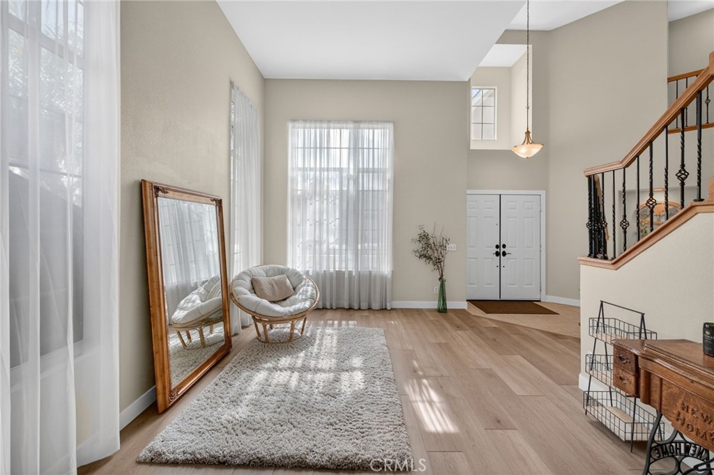 28322 Corte Ocaso Temecula, CA 92592 - Photo 14 of 75 a view of an entryway with wooden floor and door