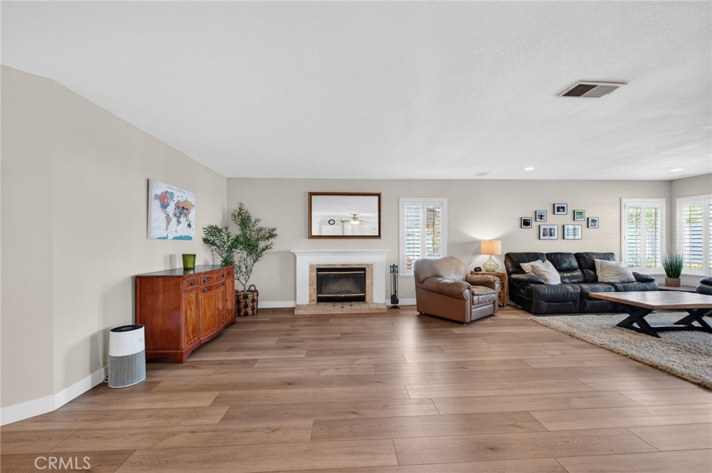 28322 Corte Ocaso Temecula, CA 92592 - Photo 21 of 75 a living room with furniture and a fireplace