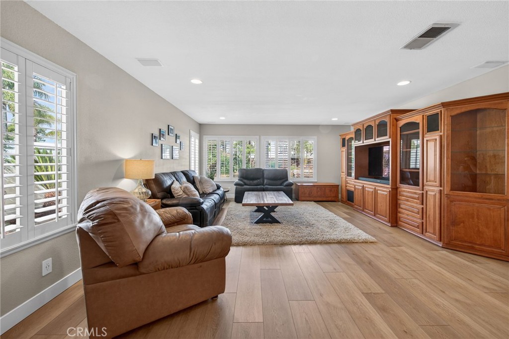 28322 Corte Ocaso Temecula, CA 92592 - Photo 24 of 75 a living room with furniture and a flat screen tv