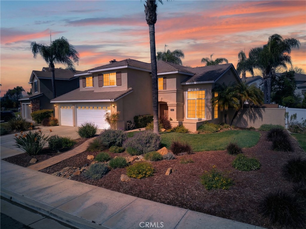 28322 Corte Ocaso Temecula, CA 92592 - Photo 3 of 75 a front view of a house with a yard and potted plants