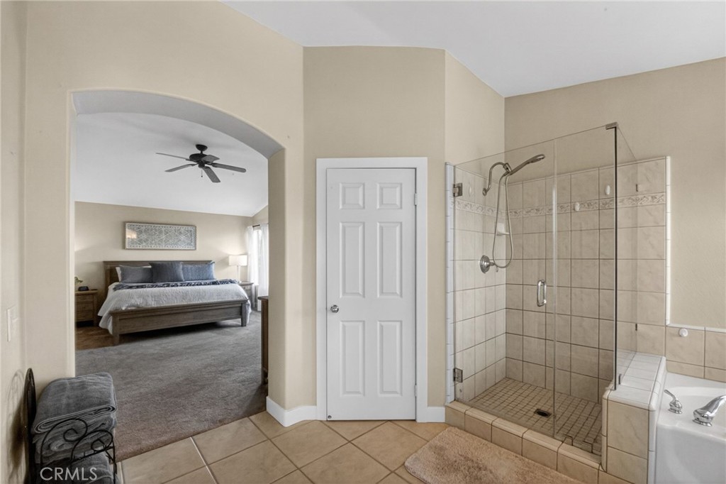 28322 Corte Ocaso Temecula, CA 92592 - Photo 46 of 75 a bathroom with a shower and a bathtub