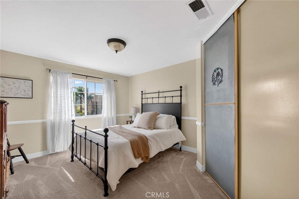28322 Corte Ocaso Temecula, CA 92592 - Photo 50 of 75 a bedroom with a bed and a window