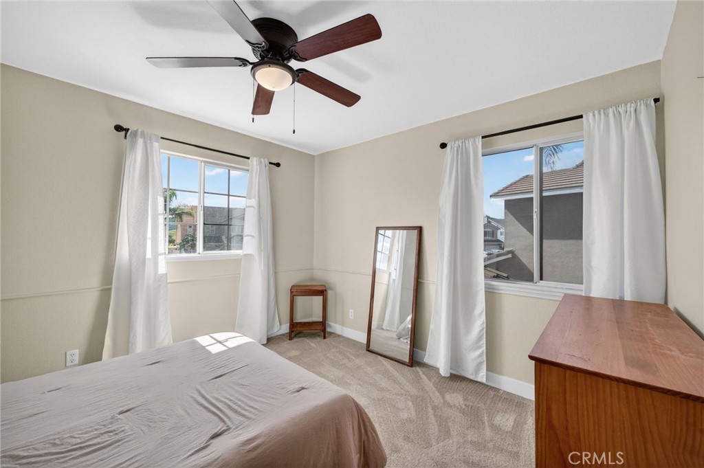 28322 Corte Ocaso Temecula, CA 92592 - Photo 52 of 75 a bedroom with a bed dresser and a window