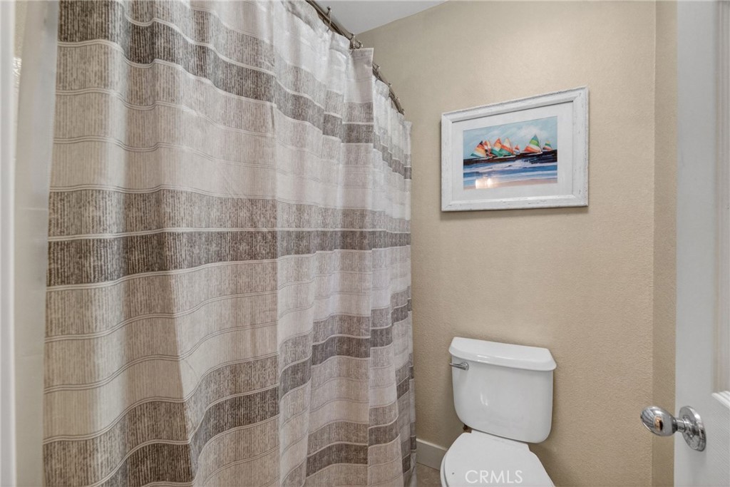 28322 Corte Ocaso Temecula, CA 92592 - Photo 55 of 75 a white toilet sitting next to a bathroom