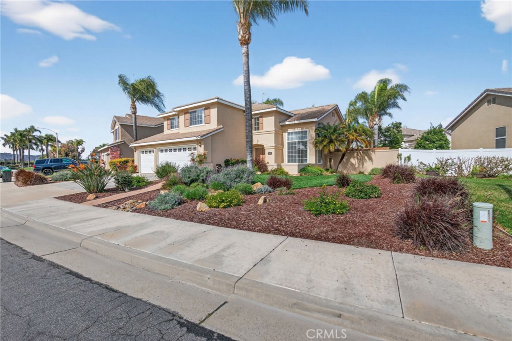 28322 Corte Ocaso Temecula, CA 92592 - Photo 6 of 75 a front view of a house with a yard and a garage
