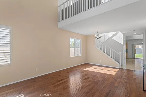 a view of an entryway with wooden floor