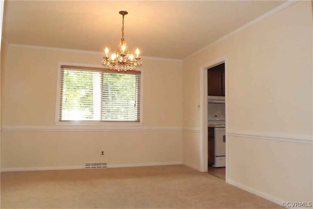 13104 Middlebrook Road Chester, VA 23831 - Photo 4 of 22 Formal Dining Room has Chair Rail & Crown Molding.