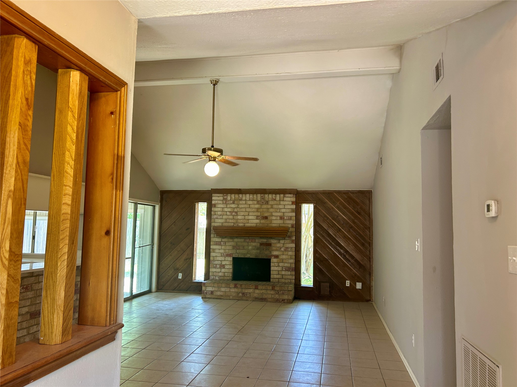 2510 Knollbrook Lane Spring, TX 77373 - Photo 5 of 24 a view of an empty room with a fireplace and a window