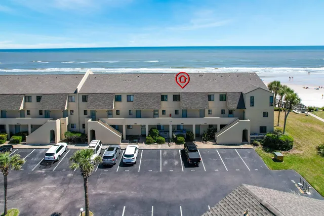 a view of a chairs and table in patio