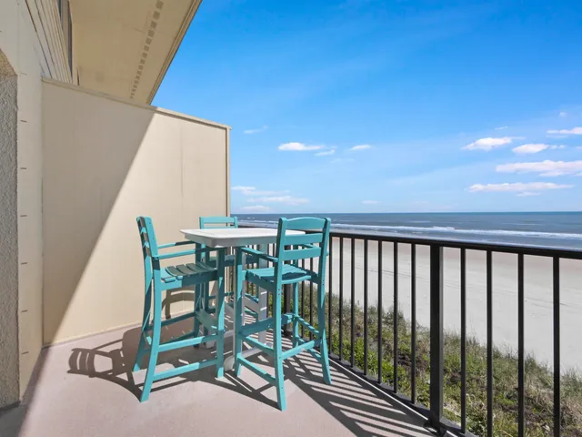 a balcony with chairs