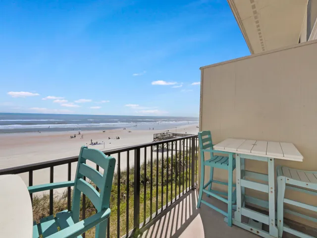 a view of a hallway with wooden floor and closet