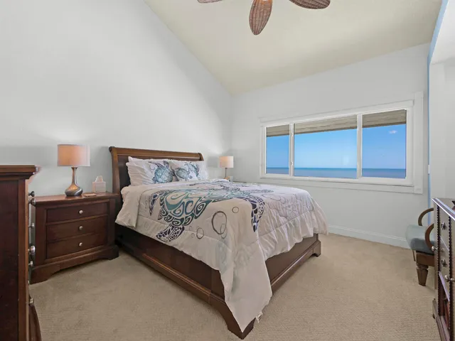 a bedroom with a bed and a television