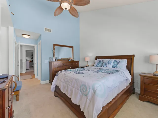 a bathroom with a sink a toilet a mirror and shower