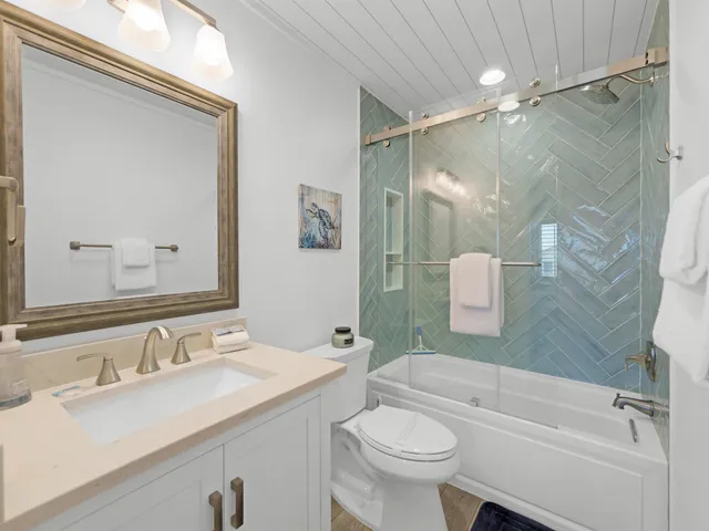 a view of a street with a wooden fence