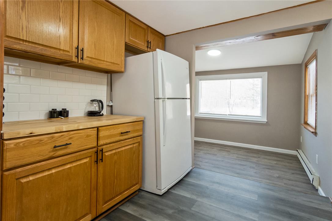 121 Short Ridge Road Albrightsville, PA 18210 - Photo 27 of 35 Natural wood cabinetry and classic subway tile backsplashes define this efficient kitchen space.