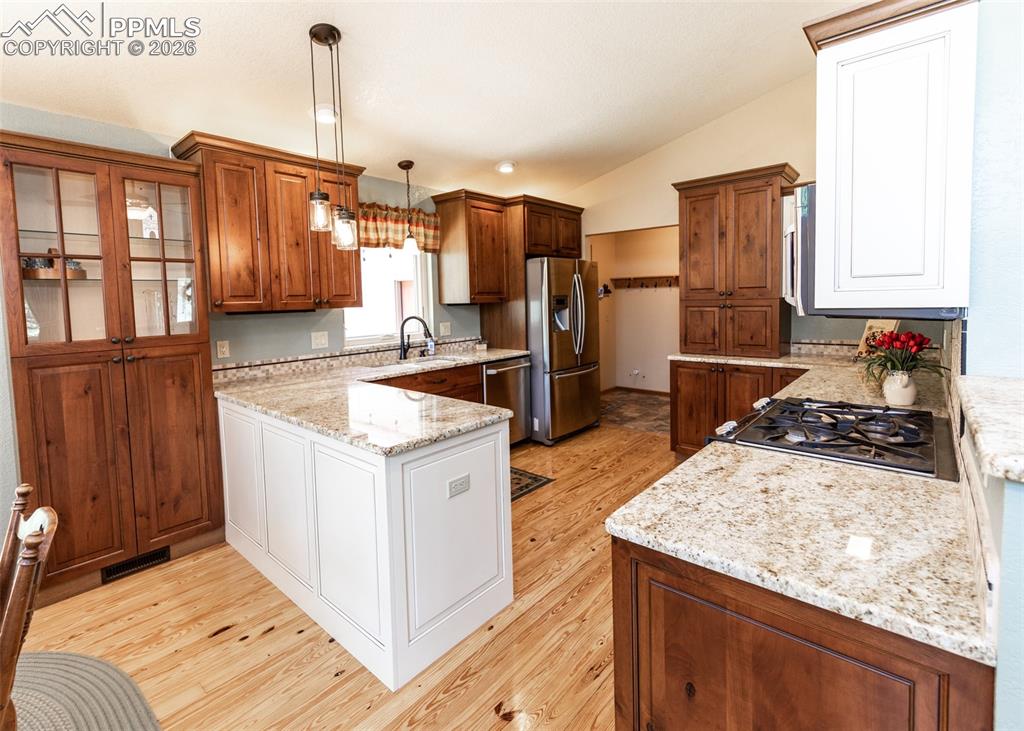 2602 Southpark Road Florissant, CO 80816 - Photo 17 of 50 You'll love this upscale country kitchen with cherry cabinetry. Abundant storage and display options.